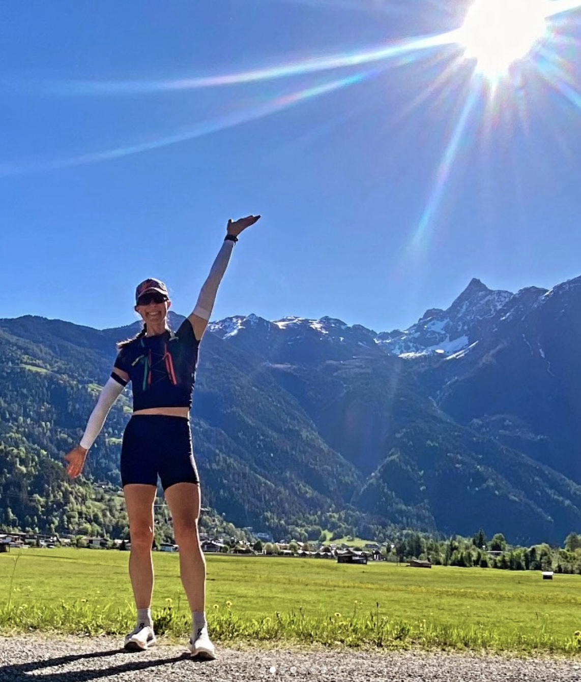 Katelyn celebrating in the mountains on a sunny day